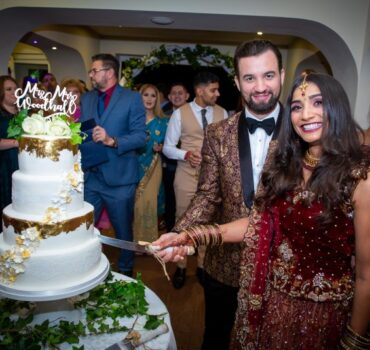 Bride and Groom cutting the cake