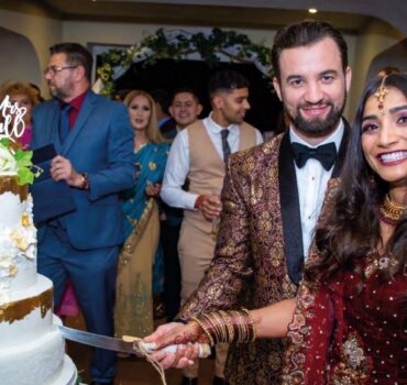 Bride and Groom cutting the cake